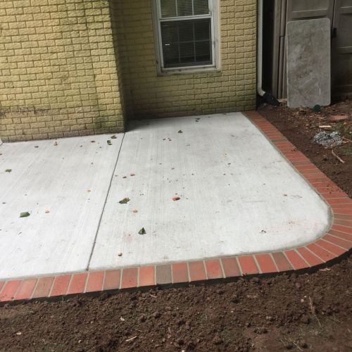 Concrete Patio with Brick Borders in Herndon, Virginia - Wright's Concrete