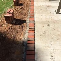 Concrete Driveway, Sidewalk, Concrete Patio with Brick Borders, Retaining Wall in Springfield VA - Wright's Concrete