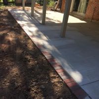 Concrete Driveway, Sidewalk, Concrete Patio with Brick Borders, Retaining Wall in Springfield VA - Wright's Concrete