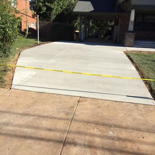 Concrete Driveway, Sidewalk, Concrete Patio with Brick Borders, Retaining Wall in Springfield VA - Wright's Concrete