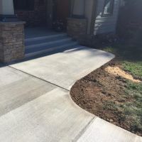 Concrete Driveway, Sidewalk, Concrete Patio with Brick Borders, Retaining Wall in Springfield VA - Wright's Concrete